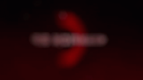 A Blurry Image Of The Word Champion On A Dark Background GIF