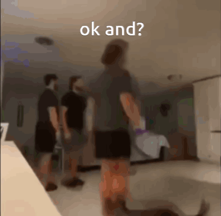 A Blurry Photo Of A Person Standing In A Room With The Words Ok And Written On The Bottom GIF