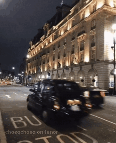 A Blurry Photo Of A Street At Night With The Words Chaeochaeq On Tenor GIF