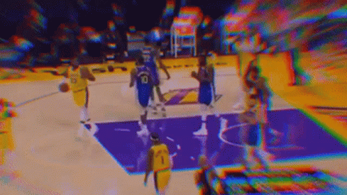 A Blurry Picture Of A Basketball Game Being Played On A Purple Court . GIF