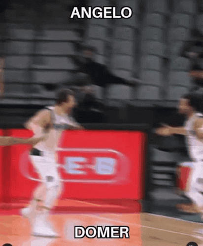 A Blurry Picture Of A Basketball Game With The Words Angelo And Domer GIF