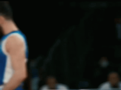 A Blurry Picture Of A Basketball Player Wearing A Blue And White Jersey With The Number 1 On It GIF