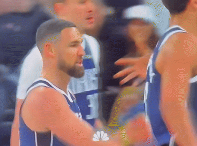 A Blurry Picture Of A Basketball Player Wearing A Number 3 Jersey GIF