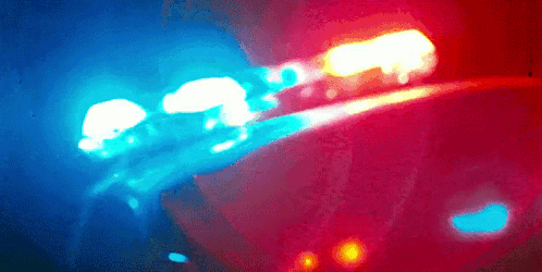 A Blurry Picture Of A Blue And Red Light GIF