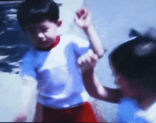 Blurry Picture Of Boy And Girl Playing GIF