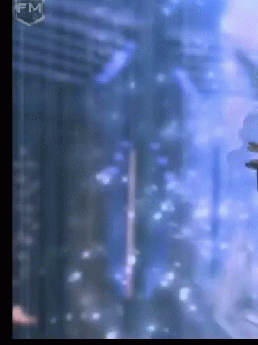 A Blurry Picture Of A Building With The Fm Logo On The Bottom GIF