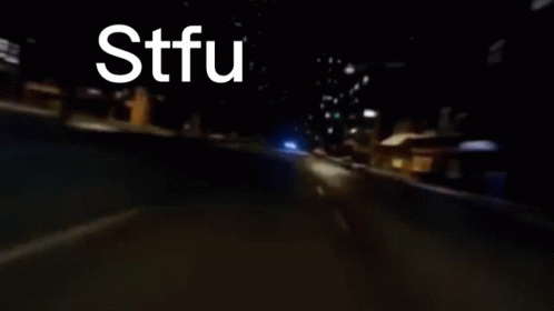A Blurry Picture Of A Car With Stfu Written On It GIF