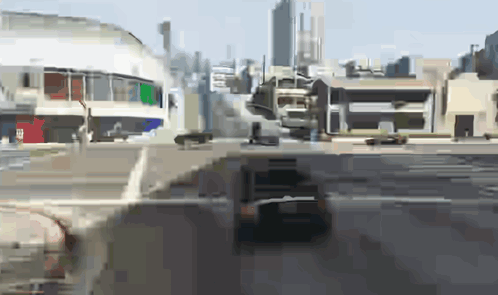 A Blurry Picture Of A City With A Few Buildings GIF