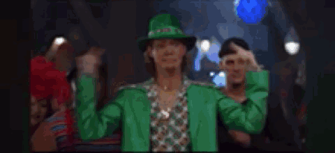 A Blurry Picture Of A Crowd Of People Dancing In A Bar . GIF