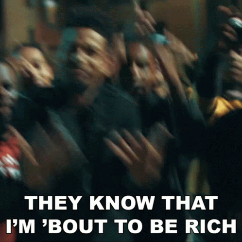 A Blurry Picture Of A Crowd Of People With The Words `` They Know That I 'M ' Bout To Be Rich '' . GIF