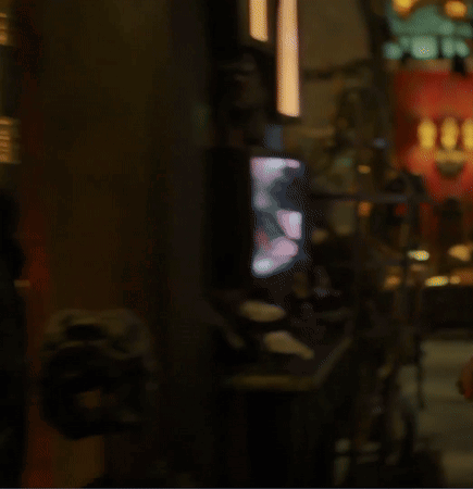 A Blurry Picture Of A Dark Room With A Few Lights Visible GIF