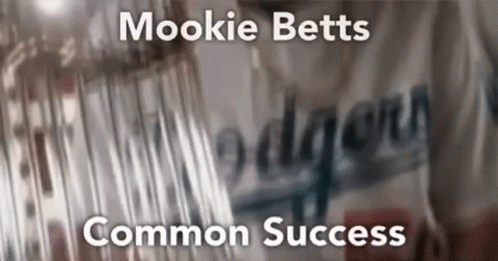 A Blurry Picture Of A Dodgers Jersey With The Words Mookie Betts Common Success GIF