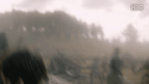 A Blurry Picture Of A Field With A Hbo Logo On The Bottom Right GIF