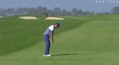 A Blurry Picture Of A Golf Course With The Word Pga Tour On The Bottom Right GIF