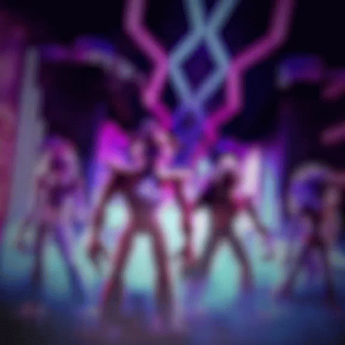 A Blurry Picture Of A Group Of People In A Dark Room With Purple And Blue Lights GIF