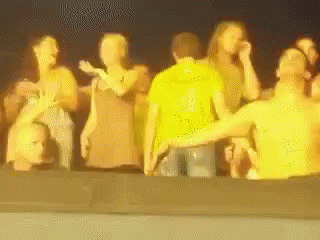 A Blurry Picture Of A Group Of People Standing Together GIF