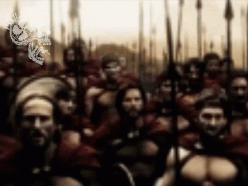 A Blurry Picture Of A Group Of Soldiers With A Skull On The Bottom Left GIF