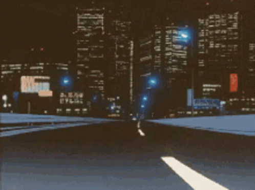 A Blurry Picture Of A Highway At Night With A Sign That Says U.s. Army GIF