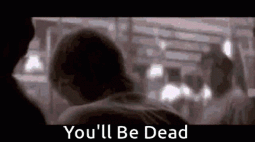 A Blurry Picture Of A Man And A Woman With The Words `` You 'Ll Be Dead '' Written In The Corner . GIF