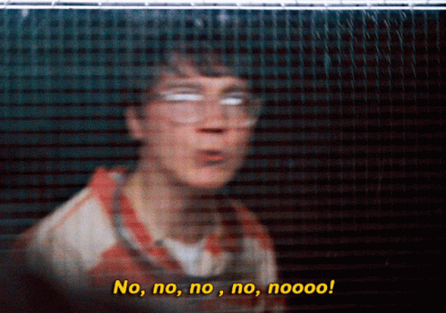 A Blurry Picture Of A Man Behind A Fence With The Words No No No No Nooo GIF