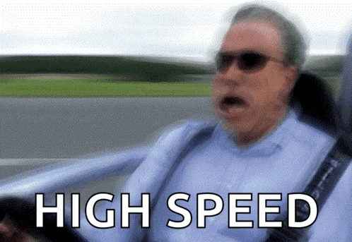 A Blurry Picture Of A Man Driving A Car With The Words High Speed Written Below Him GIF