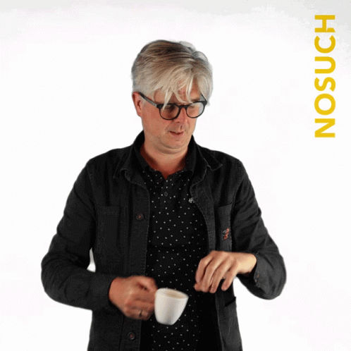 A Blurry Picture Of A Man Holding A Cup With The Word Nosuch On The Bottom GIF