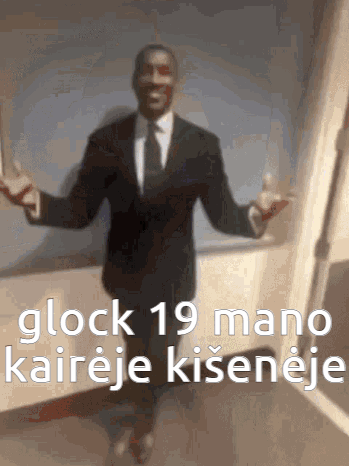 A Blurry Picture Of A Man In A Suit And Tie With The Words Glock 19 Mano Written On The Bottom GIF