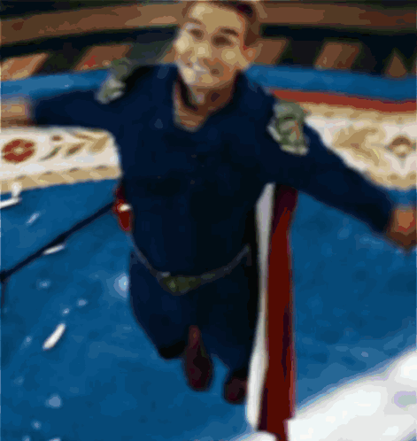 A Blurry Picture Of A Man In A Superhero Outfit GIF