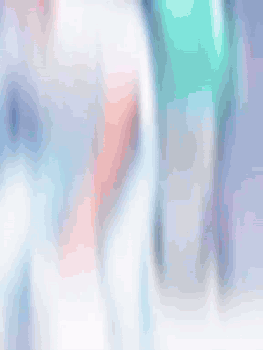 A Blurry Picture Of A Man In A White Shirt GIF