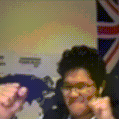 A Blurry Picture Of A Man In Front Of A Flag GIF