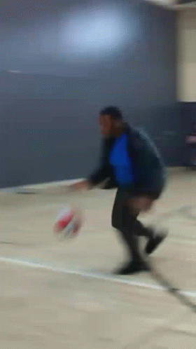 Blurry Man Kicking Soccer Ball GIF