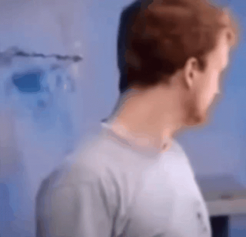 A Blurry Picture Of A Man 'S Face And Neck GIF