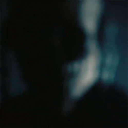 A Blurry Picture Of A Man 'S Face With Sunglasses On . GIF
