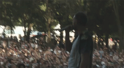 A Blurry Picture Of A Man Walking In The Woods With A Watermark That Says ' Let 'S Do It ' GIF