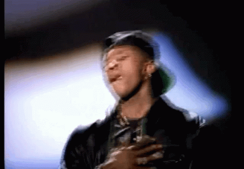 A Blurry Picture Of A Man Wearing A Hat And A Jacket GIF
