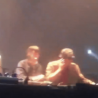 A Blurry Picture Of A Man Wearing Headphones And Sunglasses GIF