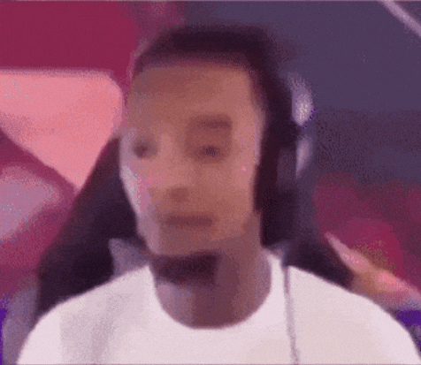 A Blurry Picture Of A Man Wearing Headphones . GIF