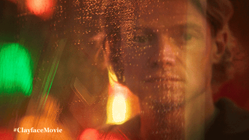 A Blurry Picture Of A Man With The Words #Clayfacemovie Below GIF