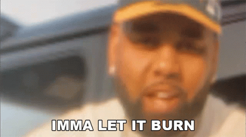 A Blurry Picture Of A Man With The Words Imma Let It Burn Above Him GIF