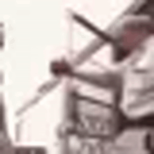 A Blurry Picture Of A Person Holding A Microphone In Their Hand . GIF