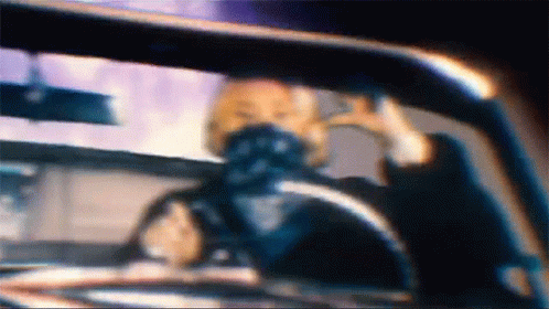 A Blurry Picture Of A Person In A Car GIF