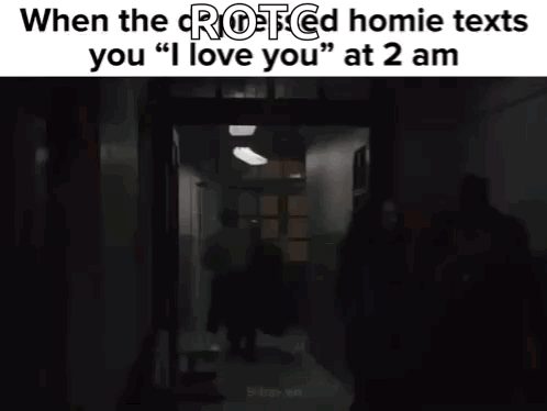 a blurry picture of a person in a dark room with the words `` i love you '' written on it .