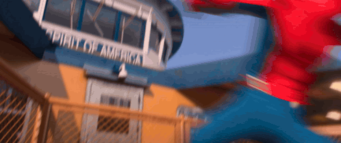 A Blurry Picture Of A Person Jumping In Front Of A Building That Says ' United States Of America ' GIF