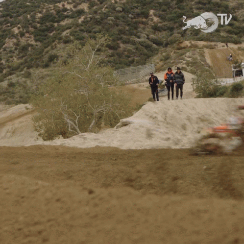 A Blurry Picture Of A Person Riding A Dirt Bike With A Red Bull Logo On The Bottom GIF