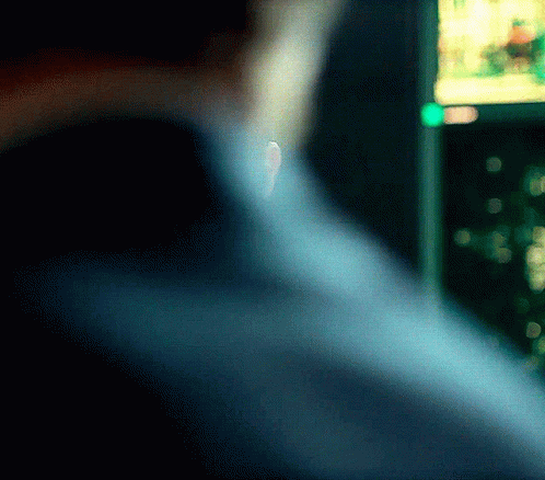 Blurry Person Back With Green Light Behind GIF