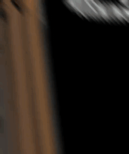 A Blurry Picture Of A Person 'S Face In A Dark Room .. GIF