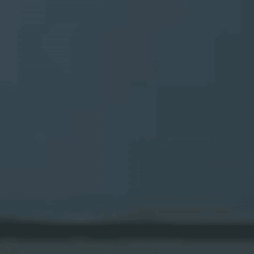 A Blurry Picture Of A Person 'S Face With A Bat On It 'S Head . GIF