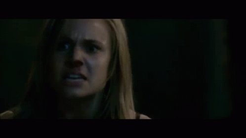 A Blurry Picture Of A Person 'S Face With A Black Background . GIF
