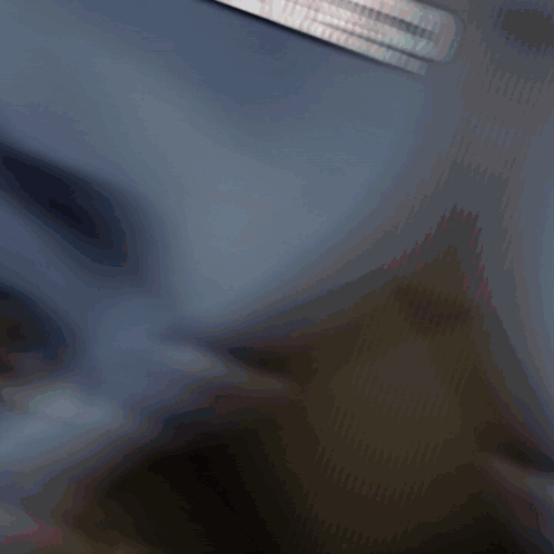 A Blurry Picture Of A Person 'S Face With A Crown On It GIF