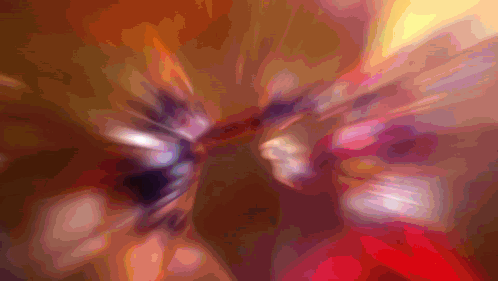 A Blurry Picture Of A Person 'S Face With A Purple And Orange Background GIF